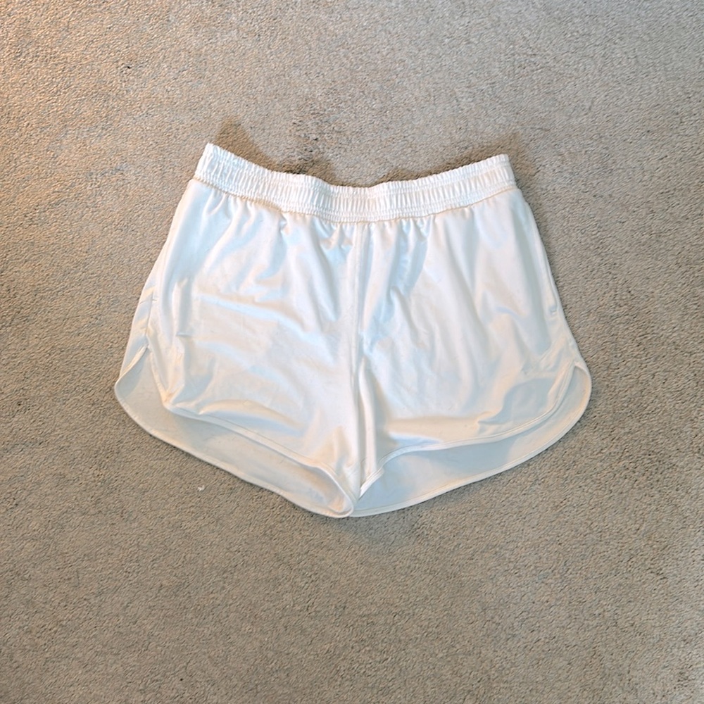 White/cream all in motion active shorts.